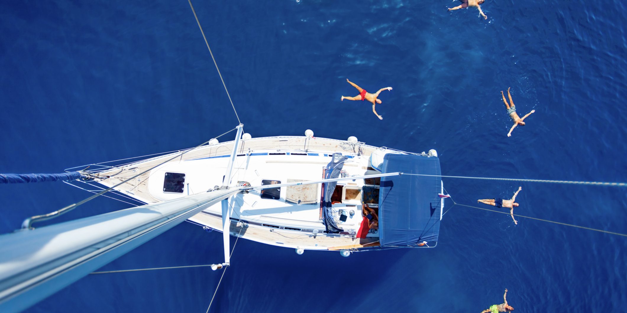 Sailing boat swimmers