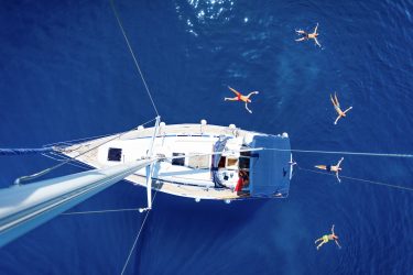 Sailing boat swimmers