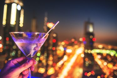 Martini against lights of Dubai